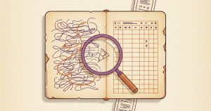 An open notebook page with scribbled handwriting and a magnifying glass resting over it