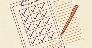 A clipboard holding a checklist card with a pen resting beside it